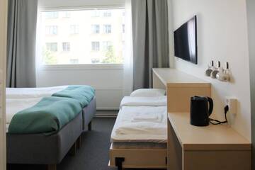 Фото номера Стандартный трехместный номер Отель GreenStar Hotel Jyväskylä г. Йювяскюля 3