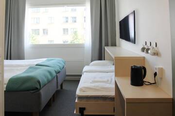 Фото номера Стандартный трехместный номер Отель GreenStar Hotel Jyväskylä г. Йювяскюля 11