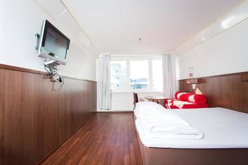 Фото номера Семейный номер Отель Omena Hotel Jyväskylä г. Йювяскюля 23